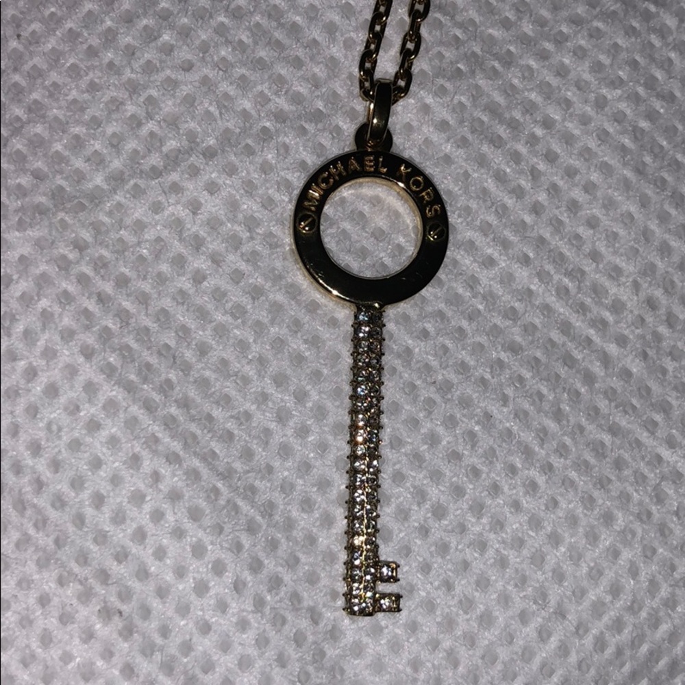 Authentic Micheal Kors gold  key charm and chain